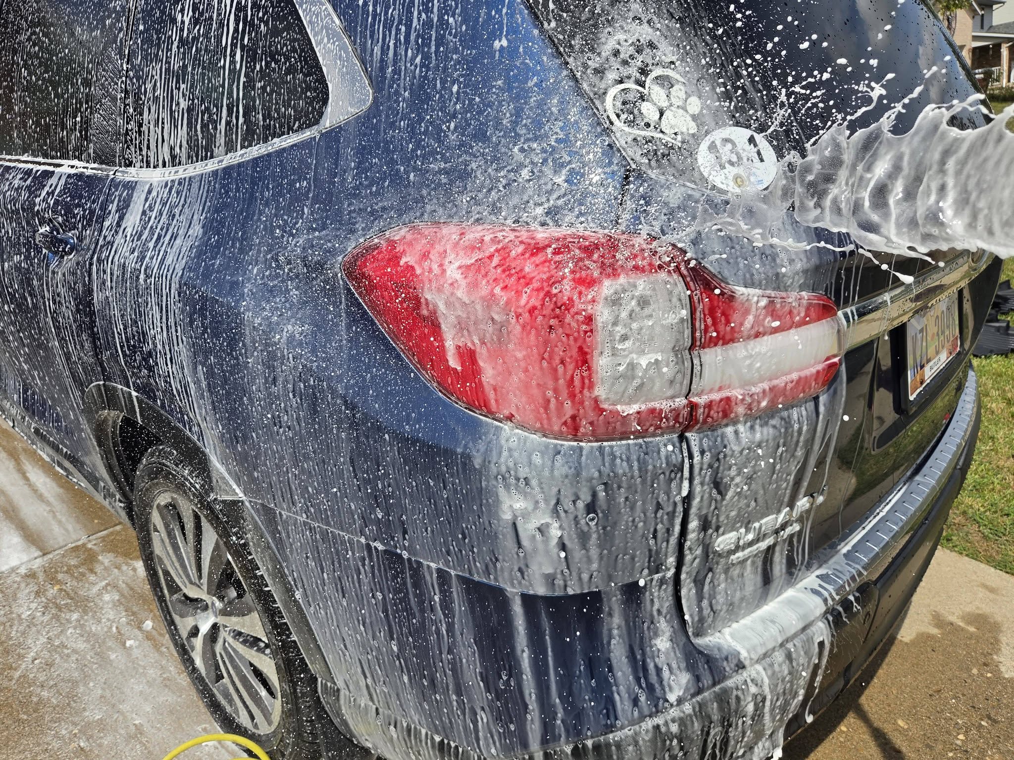 Subaru exterior covered in foam during a wash